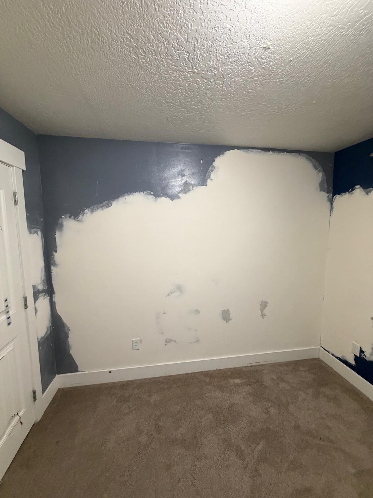 bedroom wall after repair — patched and primed wall ready for paint in Utah County