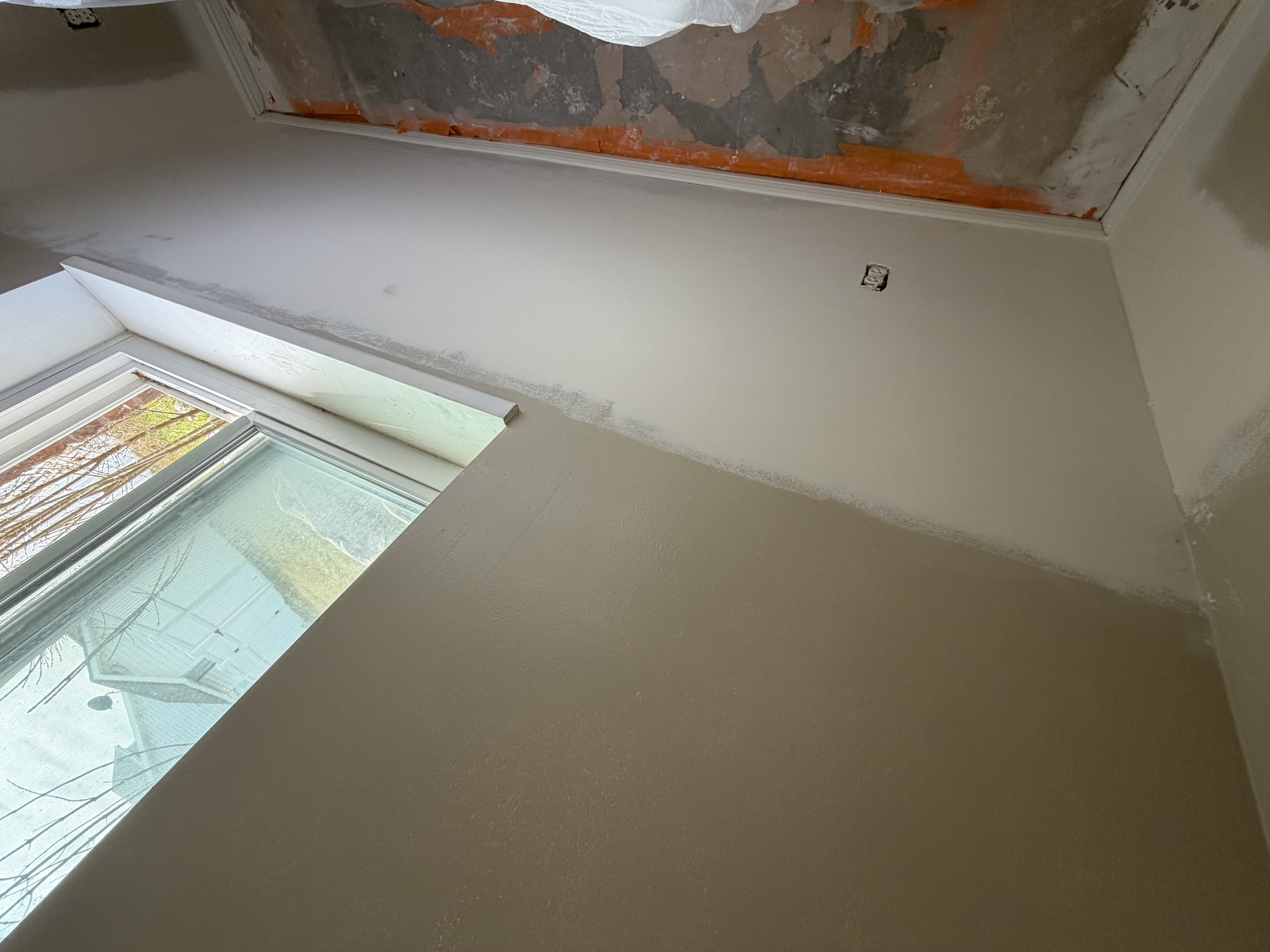 water damage wall repair after — smooth finished wall near window in Utah County