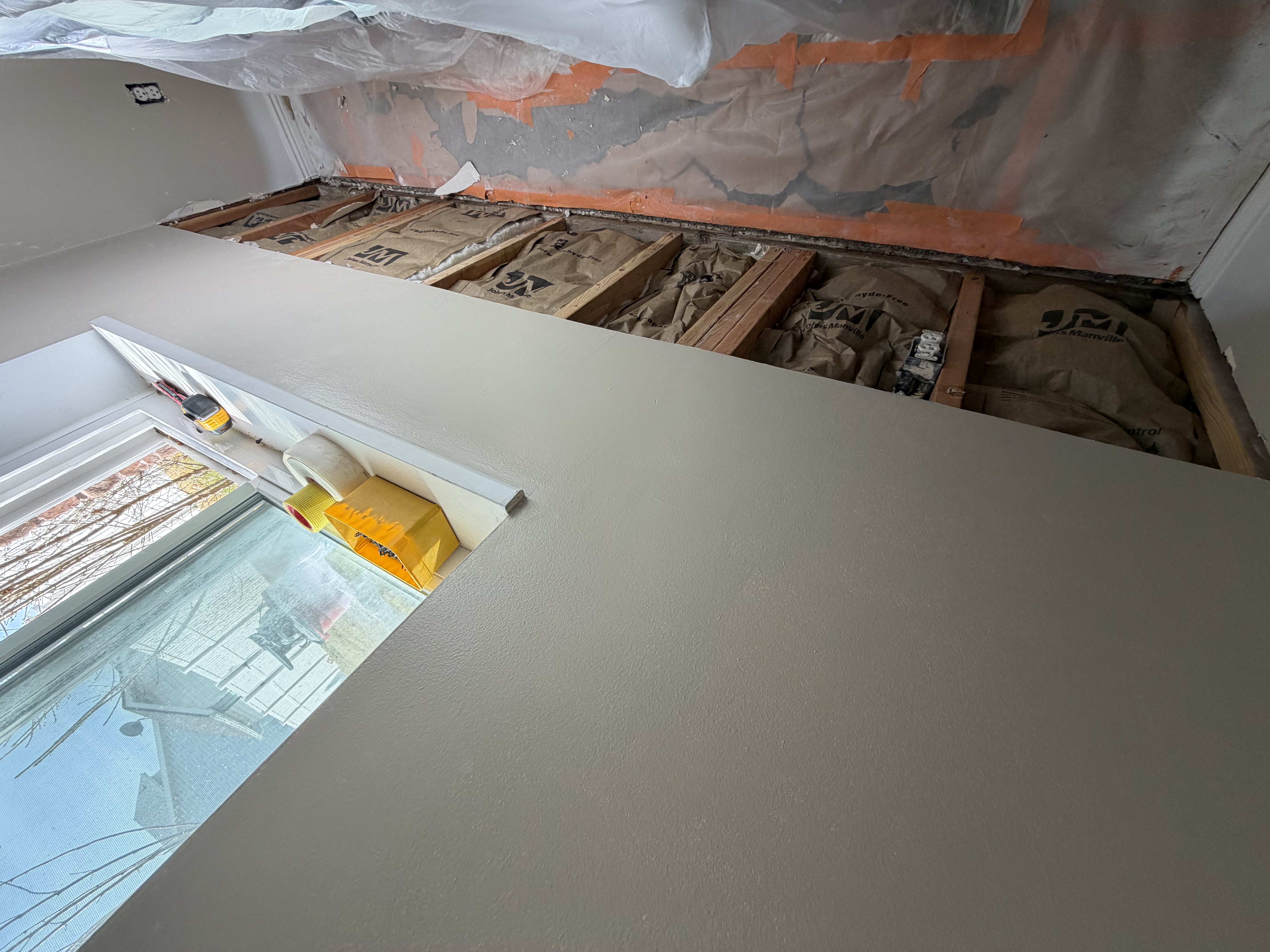 water damage wall repair before — drywall removed exposing studs and insulation in Utah County